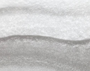 Texture of the snowdrift in cross section between two glasses.